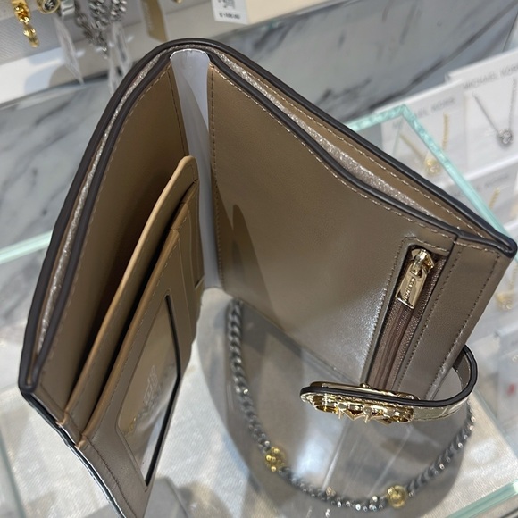 Michael Kors Empire Metallic Crocodile Embossed Leather Passport Wallet
Pale Gld - Picture 13 of 16